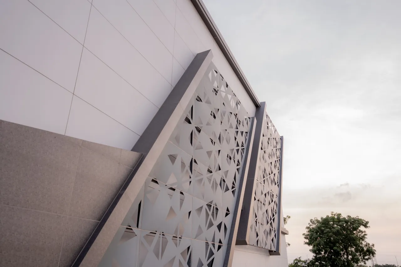 Geometric screen detail on the exterior of Nidhee Convention Centre