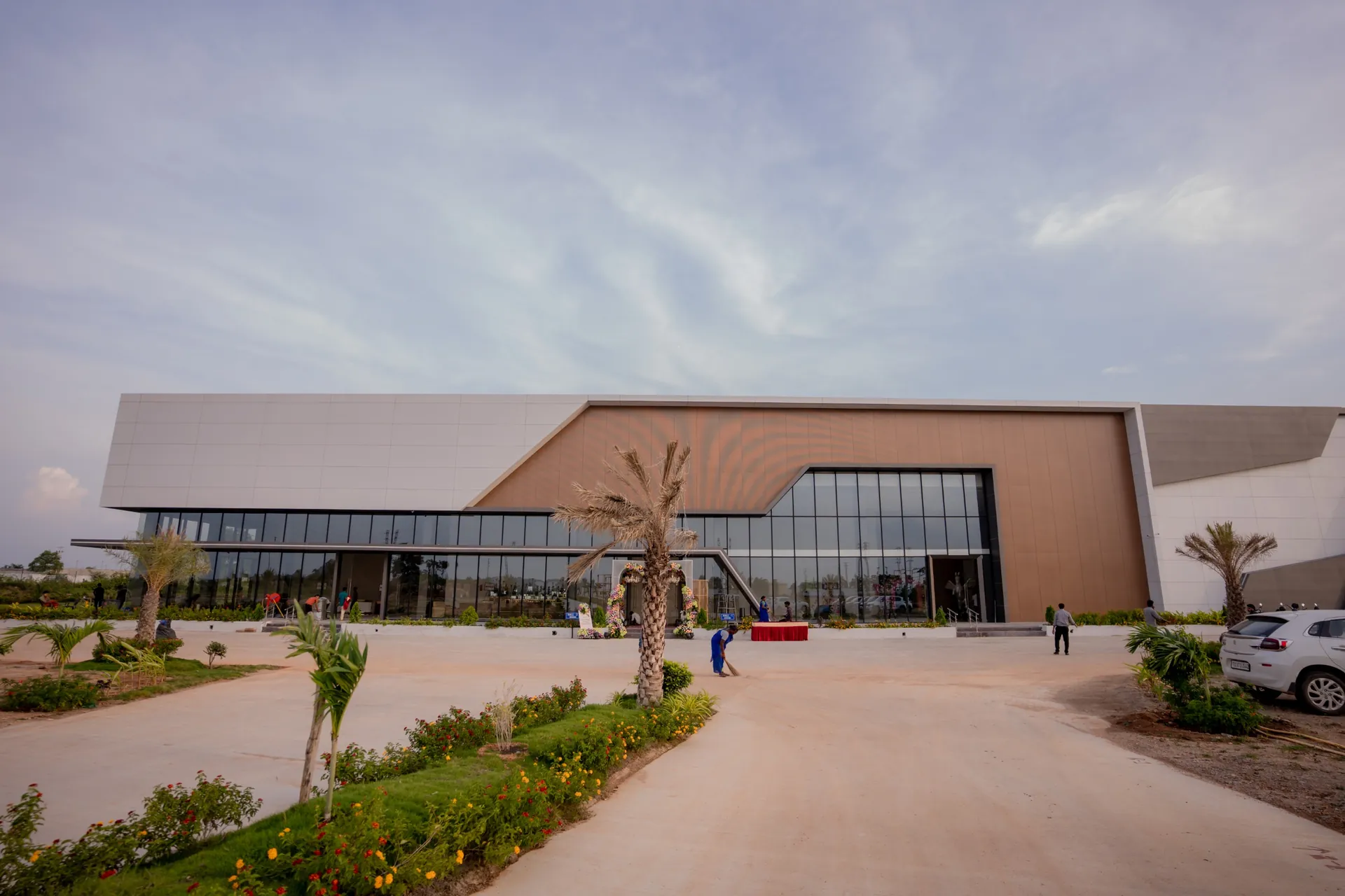 Daylight view of Nidhee Convention Centre and its landscaped arrival